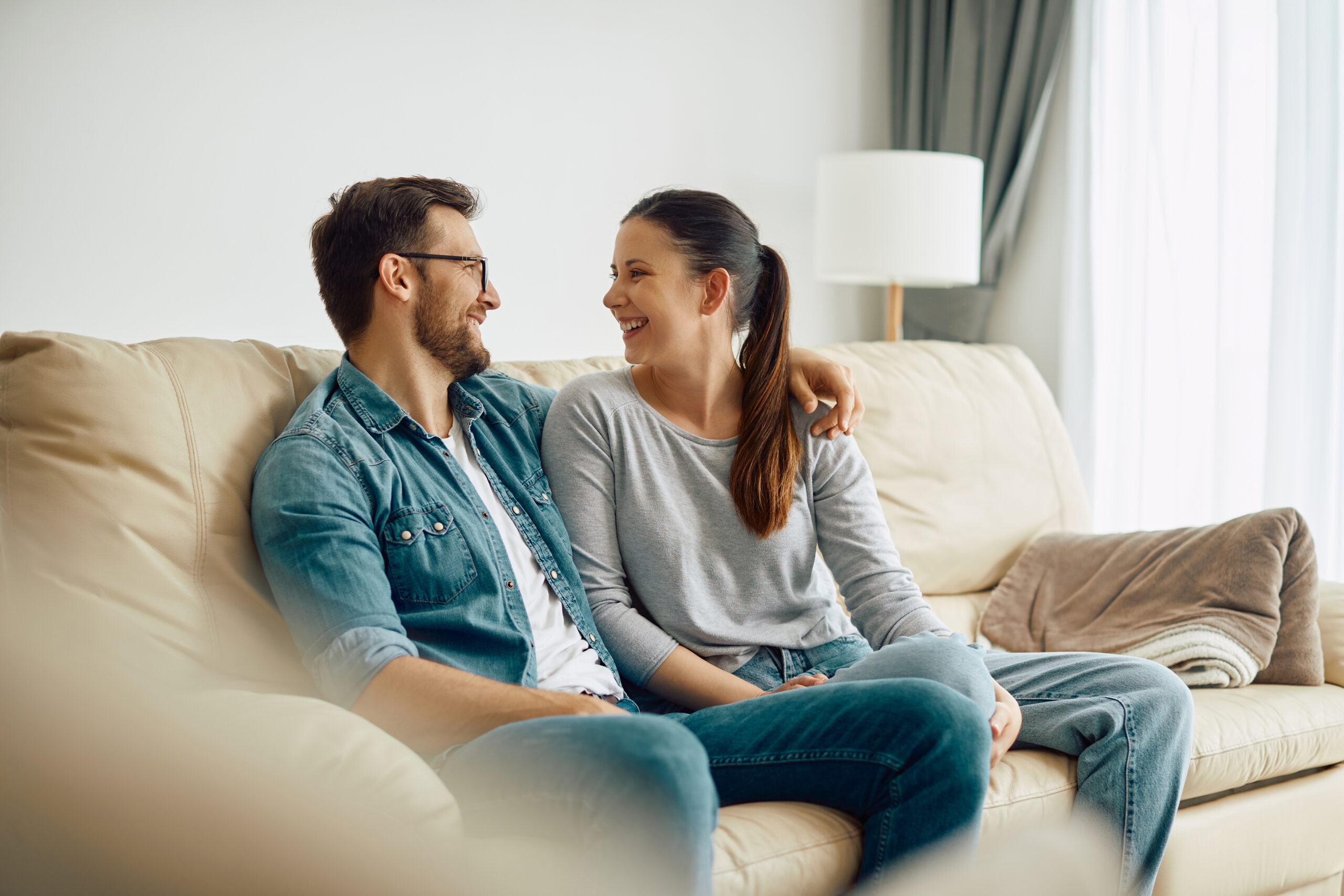 Happy couple who benefited from couples counseling and practicing effective communication strategies.