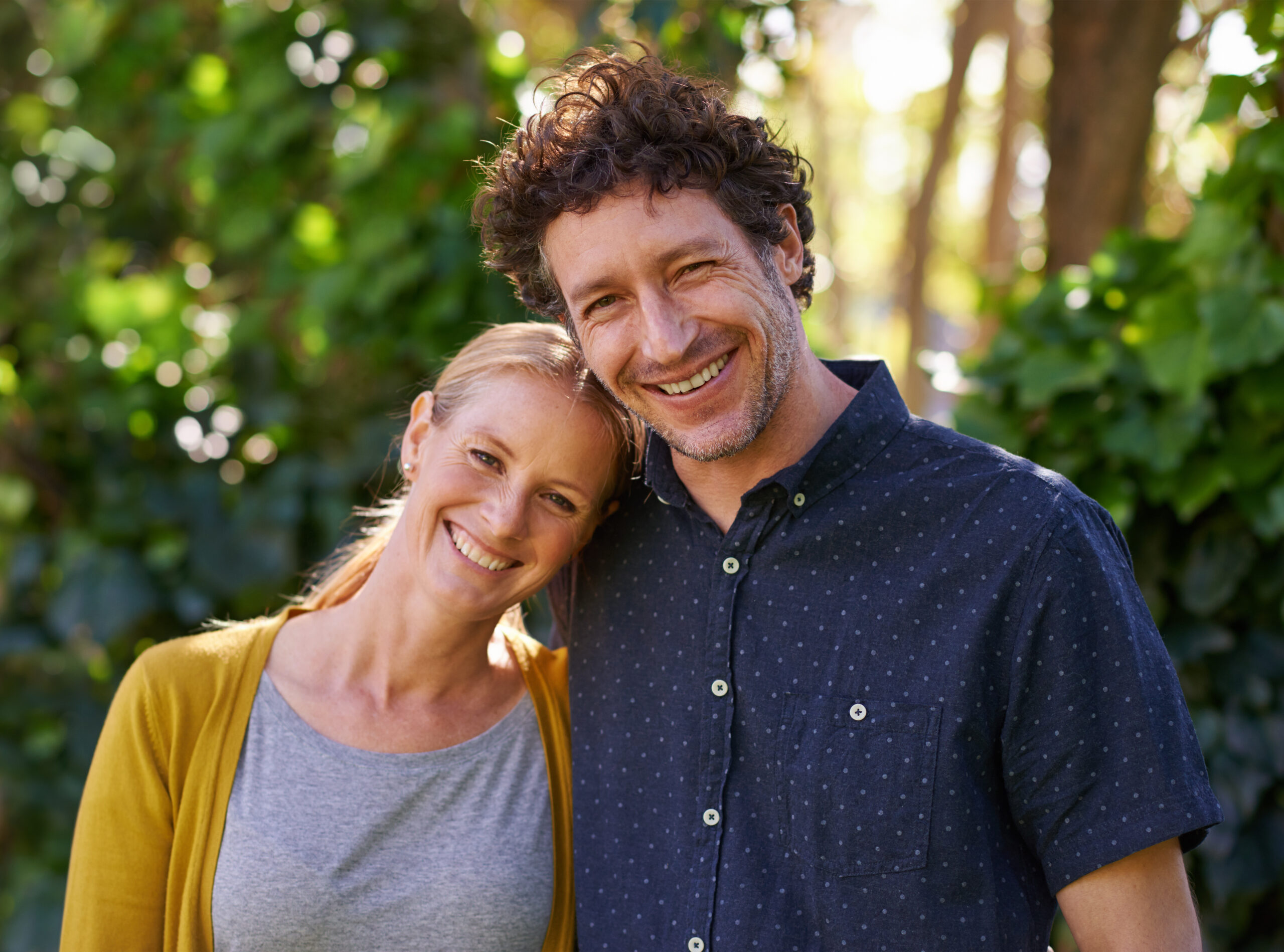 A happy couple who has successful and healthy relationship habits enjoying spending time with each other outdoors