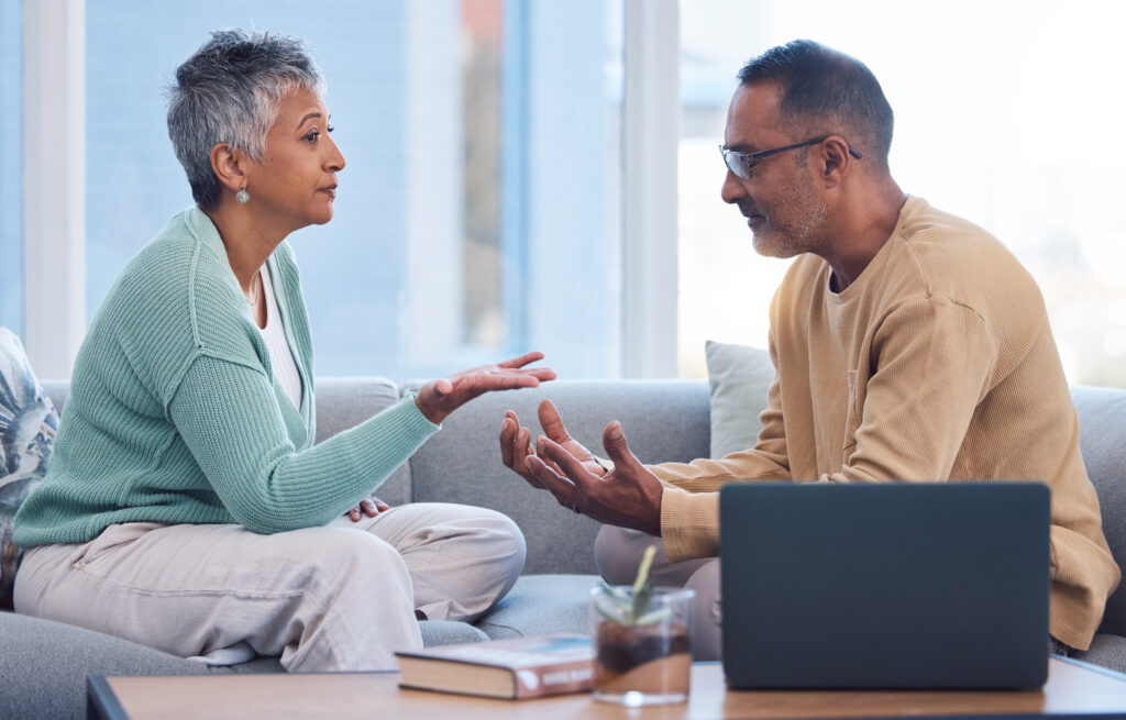 A stressed married coupling talking and learning how to rebuild trust after cheating